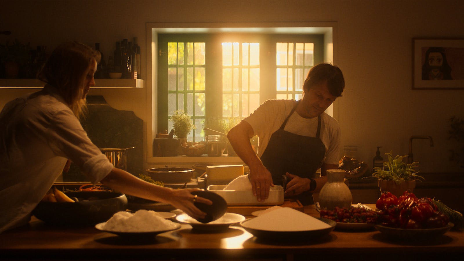 Chef René Redzepi working in his kitchen with salt and other ingredients