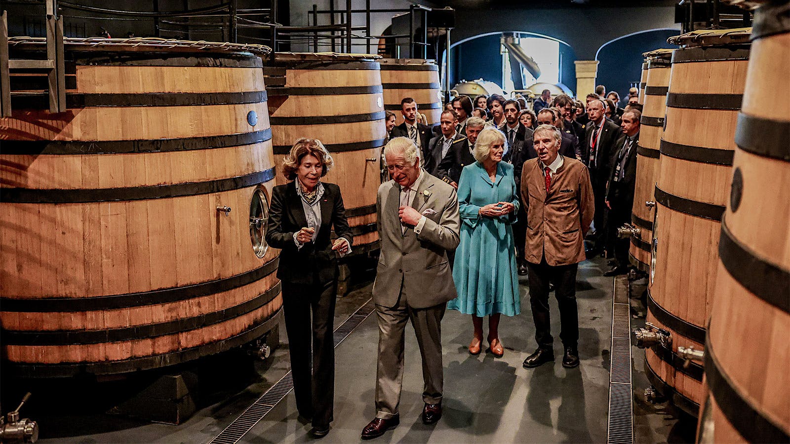 King Charles III and Queen Camilla are given a tour of the chai of Château Smith-Haut-Lafitte