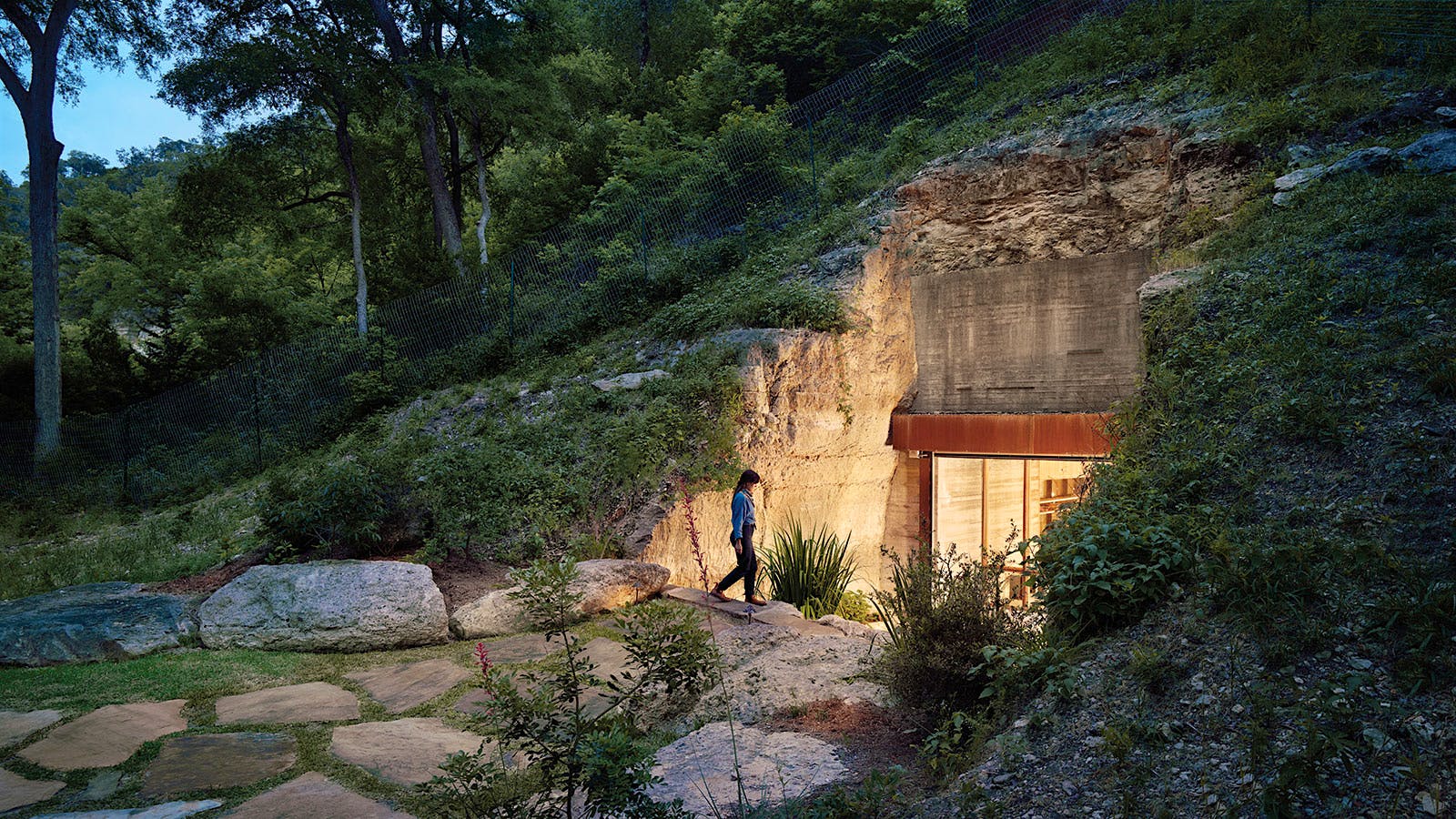 A woman enters a wine cave in the Texas Hill Country